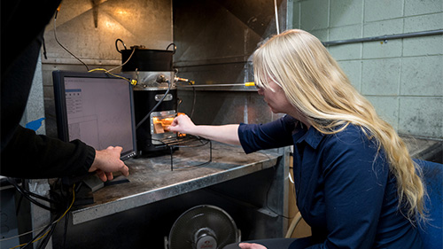 Reducing emissions in wood stoves.